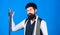 Match colors. Man bearded hipster hold few neckties on blue background. Guy with beard choosing necktie. Perfect necktie