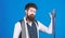 Match colors. Man bearded hipster hold few neckties on blue background. Guy with beard choosing necktie. Perfect necktie