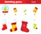 Match by size educational children game. Put gifts in Christmas stockings. New Year holidays activity for kids