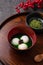 Matcha big tangyuan and matcha soup on gray table