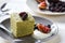 Matcha cake with fresh fruit and cream