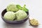 Matcha green tea ice cream balls in bowl, horizontal, copy space