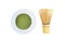 Matcha, green tea powder and bamboo whisk isolated on white