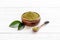 Matcha tea powder with green leaf. Asian beverage concept