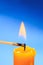 Matchstick burning candle closeup