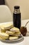 Mate and Delicious Argentinian and uruguayan cookies alfajores with cream on paper close-up on the table.