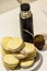 Mate and Delicious Argentinian and uruguayan cookies alfajores with cream on paper close-up on the table.