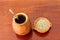 Mate Herb tea in a traditional calabash gourd with bombilla on a wooden table. Selective focus