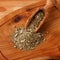 Mate with wooden scoop on wooden background