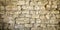 Material construction background of old vintage stones brick wall seamless stone texture