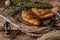 Material of delicious bread,croissant and ham bread on the plate decorate with colorful flowers,old books and antique brass keys