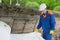 Material to protect the surface of the soil, unwinding a worker in a blue uniform and a white helmet at a construction site