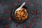 Material of traditional chinese food,spicy Mapo Tofu decorates with chilis and hot peppers on black background