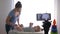 Maternal care, famous blogger mum changes clothes of infant boy while recording video lesson on cell phone for