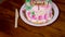 maternal grandmother birthday cake decorated with burned candles at coffee table