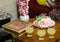 maternal grandmother birthday cake decorated with candles and juice glasses at coffee table