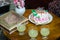 maternal grandmother birthday cake decorated with candles and juice glasses at coffee table