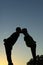 Maternity couple silhouette kissing