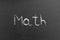 Math word written by chalk on a school blackboard before an exam