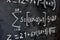 Mathematical equations written on a blackboard