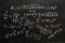 mathematical equations written on a blackboard