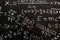 mathematical equations written on a blackboard