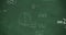 Mathmatical calcualtions written in chalk moving on a green chalkboard 4k