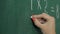 Maths` chalkboard. Hand`s writing simple mathematical equation