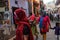 Mathura, Uttar Pradesh/ India- January 6 2020: Indian women celebrating Holi by playing with colors in the streets of mathura