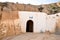 MATMATA, TUNISIA - February 03, 2009: Picture of a hand and fish symbol on traditional berber house wall in the sahara