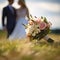 Matrimonial charm Wedding bouquet on grass, couple in the backdrop