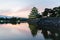 Matsumoto castle and sunset sky reflect on water at nagano japan