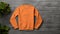 Matte Photo Mockup Of Orange Sweatshirt On Wood Wall