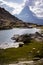 Matterhorn behind small lake with grass and rocks