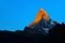 Matterhorn in early morning with alpenglow and blue sky in summer. Zermatt, Switzerland.