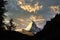 Matterhorn morning mountain, black silhouette of pine trees