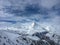 Matterhorn mountain in front of a blue sky with clouds in Zermatt, Switzerland.