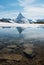 Matterhorn mountain with melting frozen lake in summer in Zermatt, Switzerland