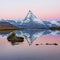 Matterhorn mountain before sunrise with reflection in the Riffelsee lake - Zermatt in Switzerland