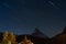Matterhorn mountain in Switzerland at night with sky full of stars, view in Zermatt in summertime