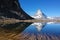 Matterhorn with reflection in lake with clear blue sky