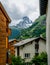 Matterhorn summit vertical view in the clouds in middle of chalet houses Zermatt Switzerland