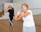 Mature active women practice vigorous swing