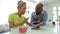 Mature African American Couple Using Digital Tablet At Home