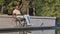 Mature African American male disabled in wheelchair waving hands, doing warm-up exercise therapy. Black man recovering