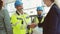 Mature architect and contractor shaking hands at construction site