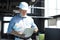 Mature architect wearing hardhat inspecting new building