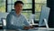 Mature Asian businessman chinese korean office worker specialist male work on computer develop project online look at