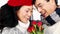 Mature Asian couple holding roses