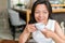 Mature Asian woman drinking english breakfast tea relaxing at cafe. Chinese middle-aged lady enjoying city lifestyle